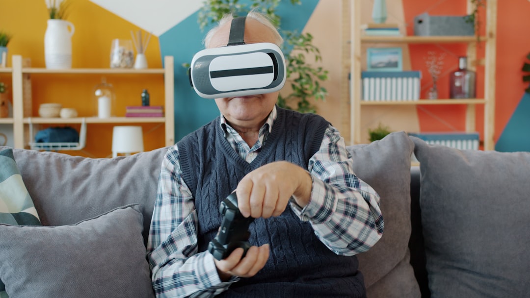 Elderly man wearing vr headset plays video game